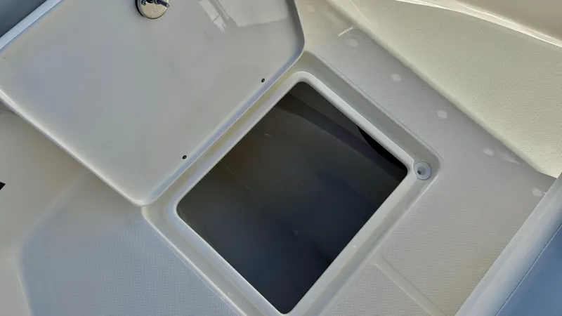 Slide: The Image of Open storage compartment on 2025 Bulls Bay 230CC boat deck. - 15