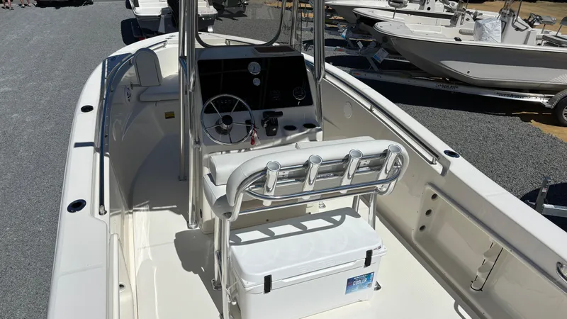 Slide: The Image of 2025 Bulls Bay 230CC boat interior with steering console and seating. - 6