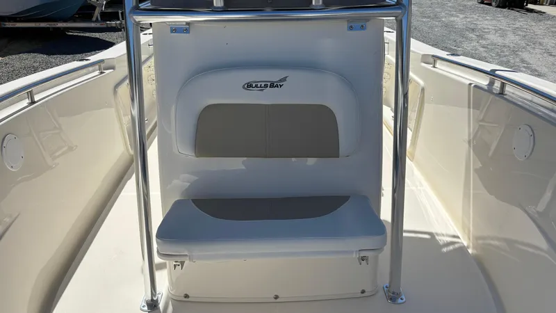Slide: The Image of 2025 Bulls Bay 230CC boat interior with seating and console. - 8