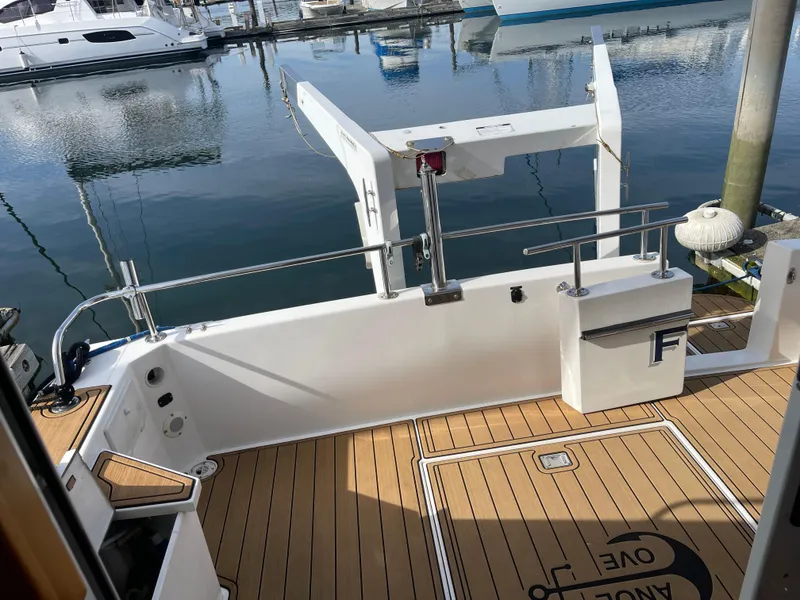 Slide: The Image of Canoe Cove 50 Pilothouse Luxury Yacht deck, 2002 model, docked at marina. - 18