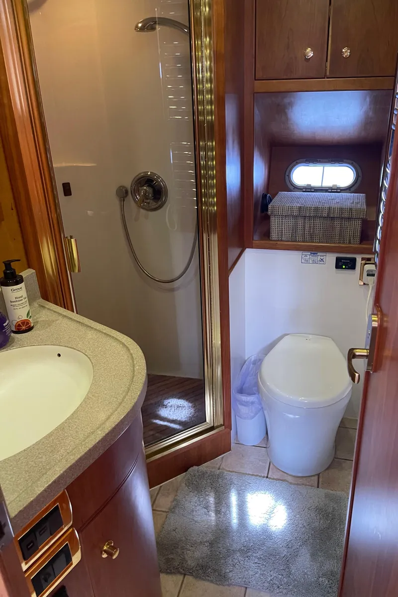 Slide: The Image of Luxurious bathroom in 2002 Canoe Cove 50 Pilothouse Yacht with shower and modern amenities. - 22