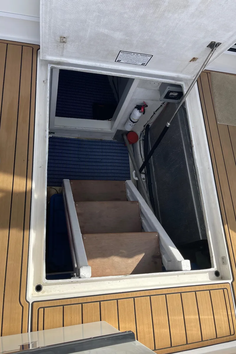 Slide: The Image of Stairway leading below deck on 2002 Canoe Cove 50 Pilothouse Luxury Yacht. - 24