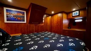 Slide: The Image of Luxurious wooden cabin interior of a 2002 Canoe Cove 50 Pilothouse Yacht. - 33