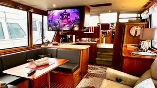 Slide: The Image of Luxurious interior of a 2002 Canoe Cove 50 Pilothouse Yacht with elegant furnishings. - 49