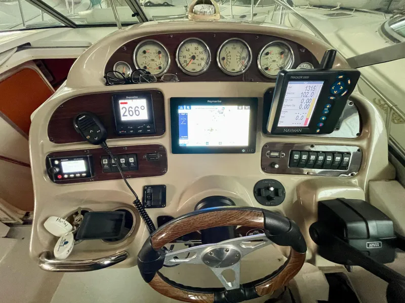 Slide: The Image of Control panel of a 2005 Chaparral Signature 310 boat with navigation instruments. - 7