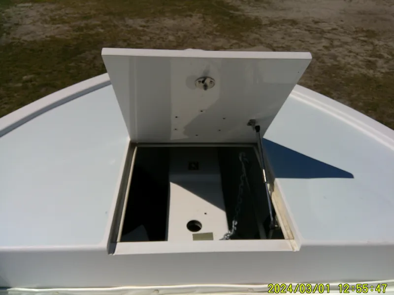 Slide: The Image of Open hatch on 2020 Southern Cross 23 boat deck, showing storage compartment. - 18