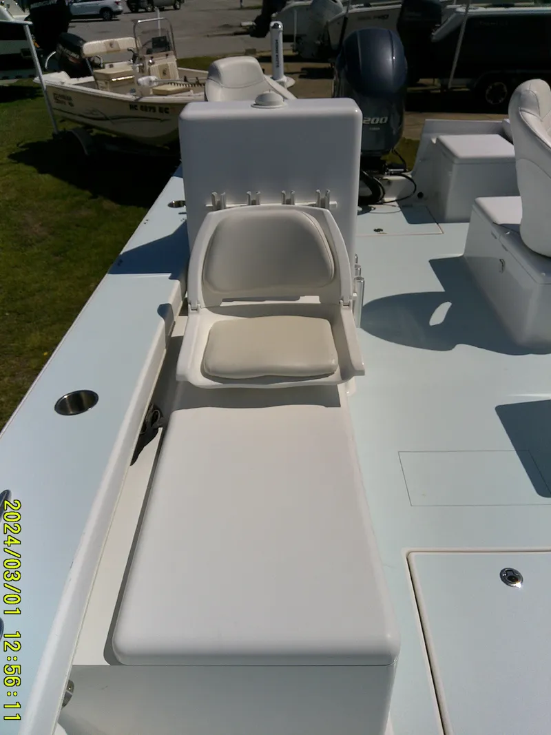 Slide: The Image of 2020 Southern Cross 23 boat interior with cushioned seating and storage. - 20
