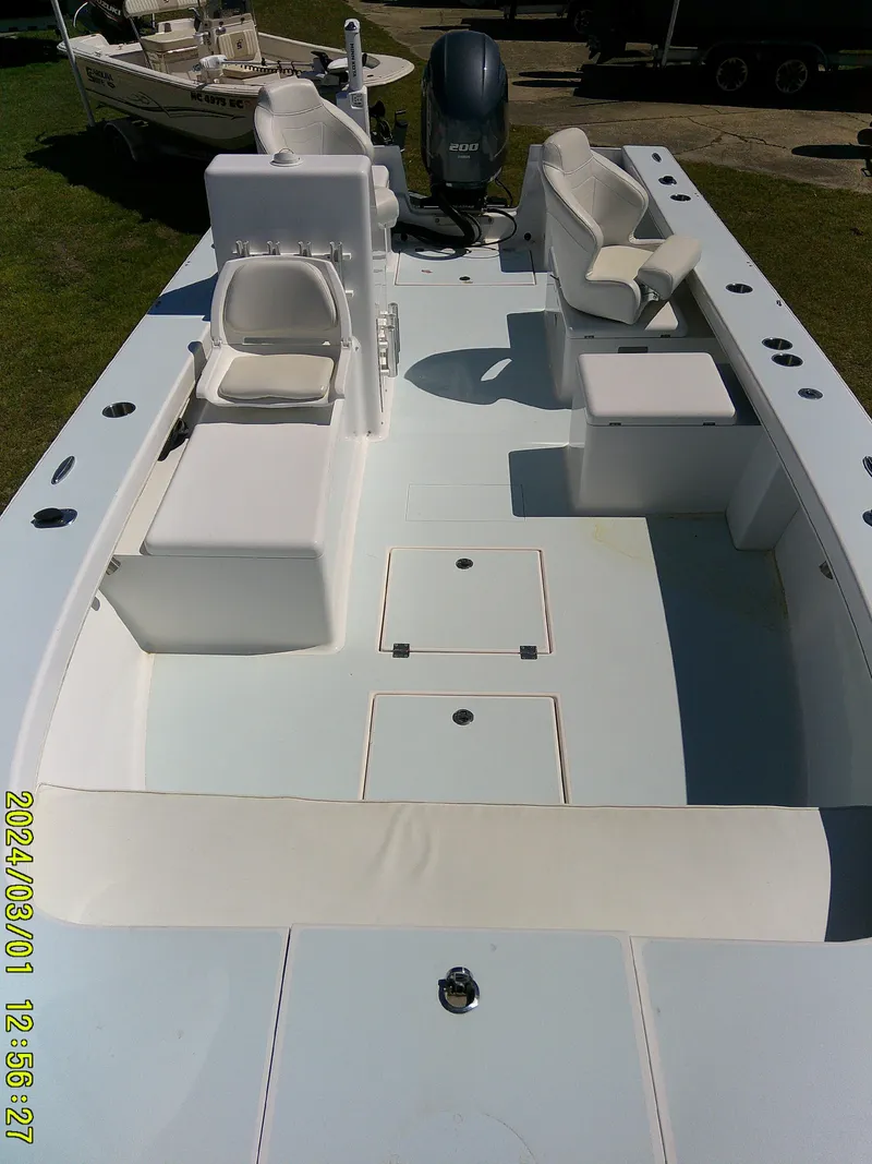 Slide: The Image of 2020 Southern Cross 23 boat interior with seating and storage compartments. - 22