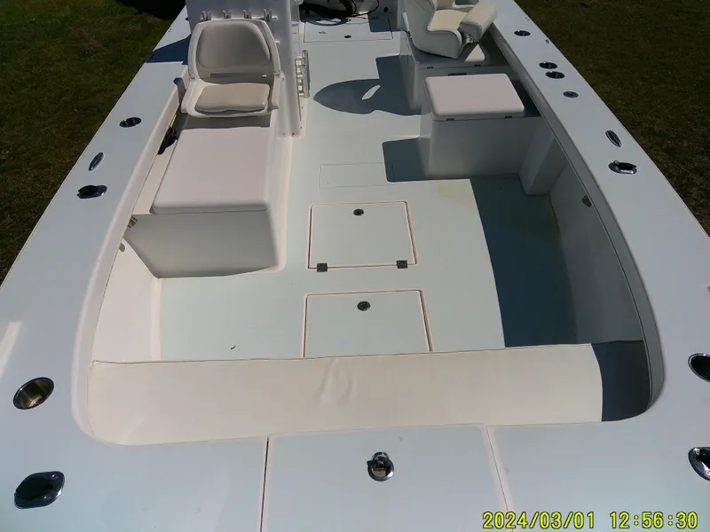 Slide: The Image of 2020 Southern Cross 23 boat interior with seating and storage compartments. - 23