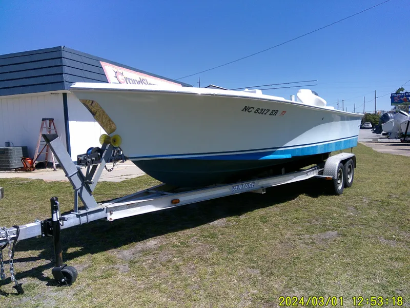 Slide: The Image of Southern Cross 23 boat on trailer, parked outdoors, sunny day, 2020 model. - 3
