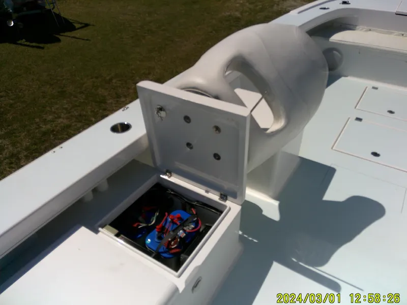 Slide: The Image of Southern Cross 23 boat battery compartment open, showcasing wiring and components. - 30