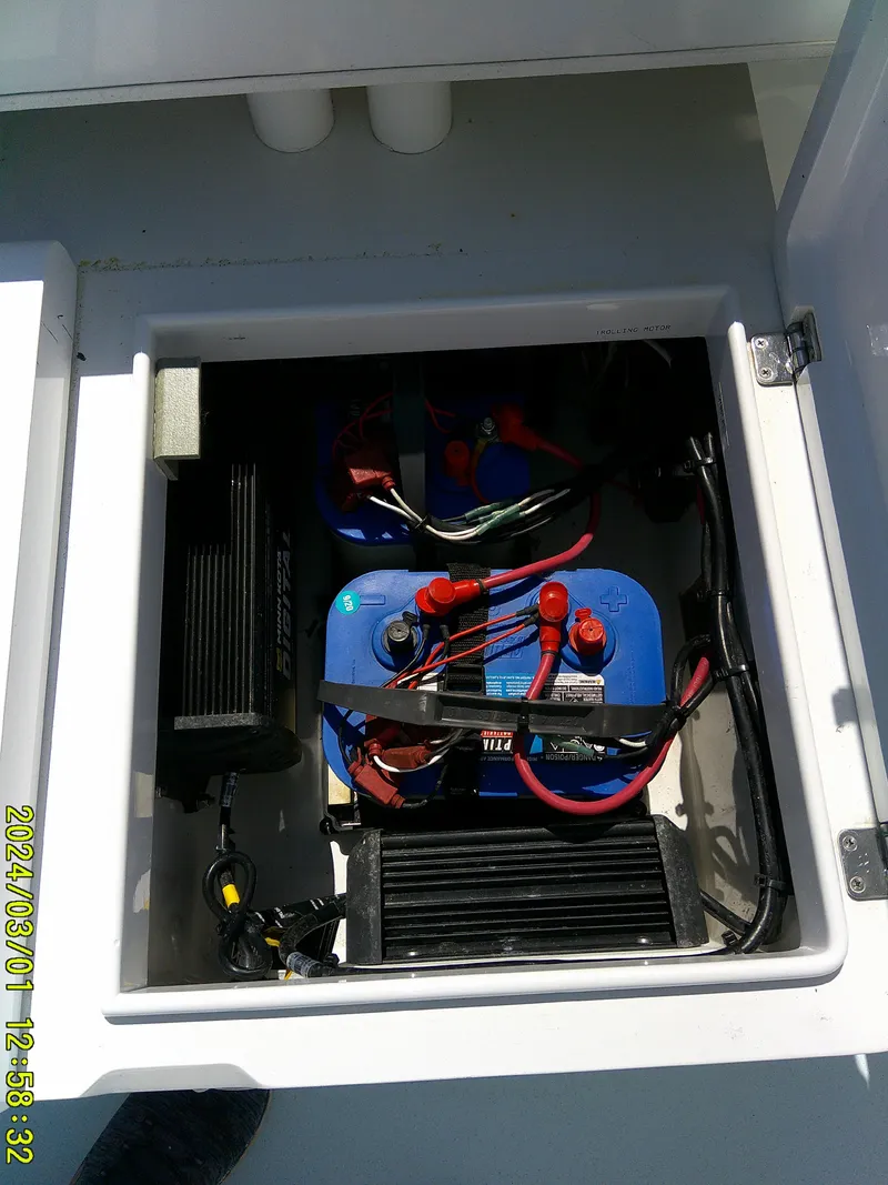 Slide: The Image of Battery compartment of 2020 Southern Cross 23 boat, showing wiring and components. - 31
