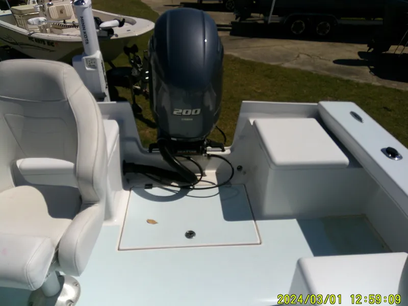 Slide: The Image of Southern Cross 23 boat interior with seating and 200 HP outboard motor, 2020 model. - 36