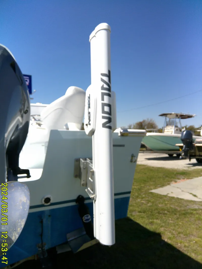 Slide: The Image of Southern Cross 23 boat with Talon anchor system, 2020 model, parked on grass. - 4