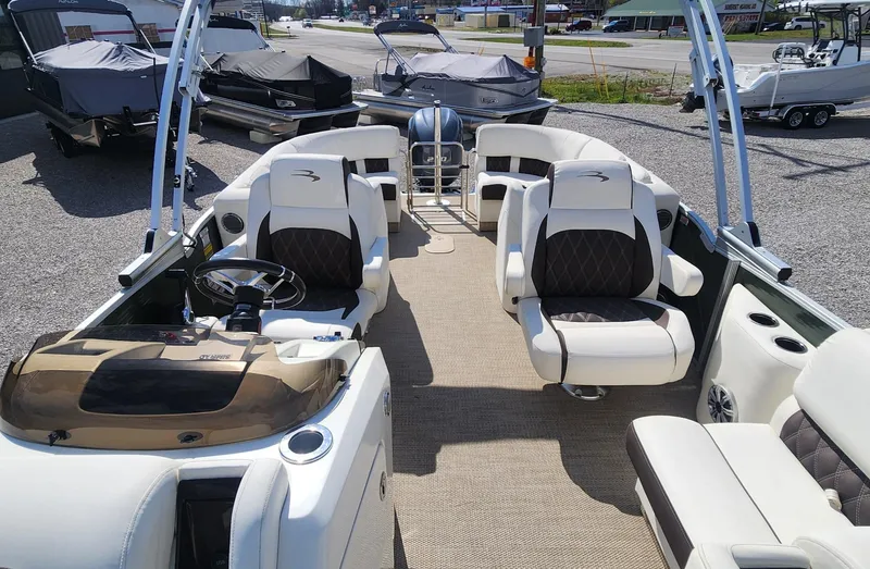 Slide: The Image of 2017 Bennington R5 2550 RCFS Saltwater Edition boat interior with seating and steering console. - 6