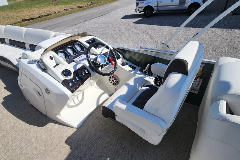 Slide: The Image of 2017 Bennington R5 2550 RCFS Saltwater Edition boat interior with steering wheel and controls. - 7