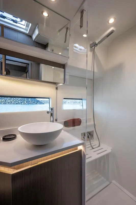 Slide: The Image of Modern bathroom in 2025 Jeanneau NC 1295 Coupe yacht with sleek fixtures and elegant design. - 36