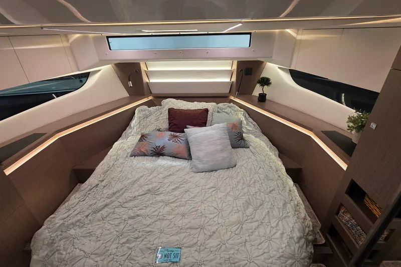 Slide: The Image of Luxurious interior cabin of 2026 Jeanneau NC 1295 Coupe with elegant bedding and modern design. - 73