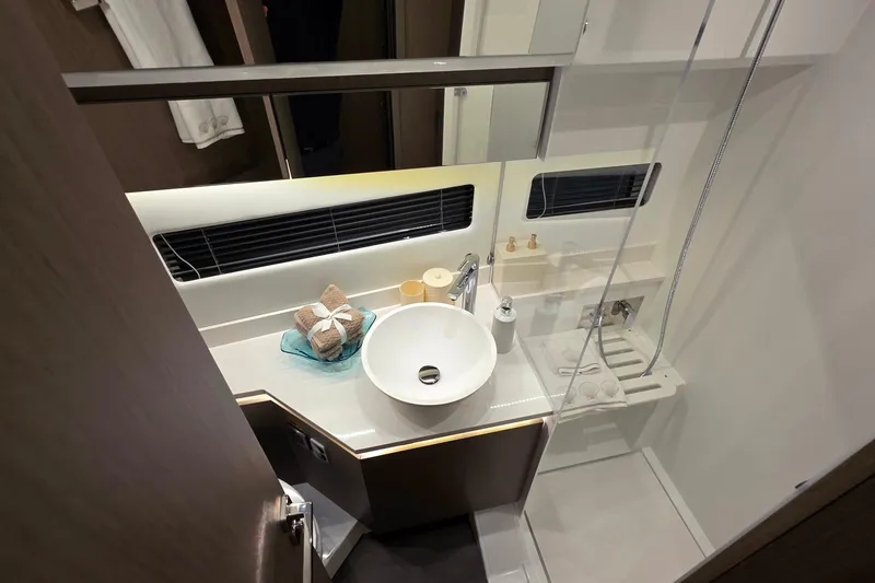 Slide: The Image of Modern bathroom interior of 2026 Jeanneau NC 1295 Coupe yacht, featuring sleek design elements. - 76