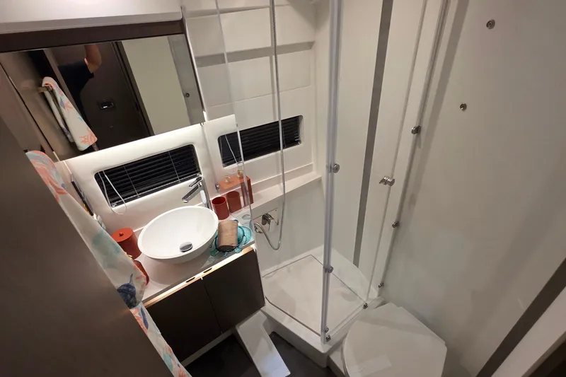 Slide: The Image of Modern bathroom in 2026 Jeanneau NC 1295 Coupe yacht with shower and sink. - 77