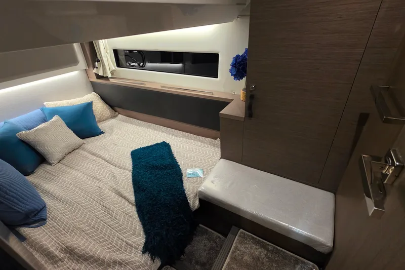 Slide: The Image of Luxurious cabin interior of 2026 Jeanneau NC 1295 Coupe with cozy bedding and modern decor. - 78