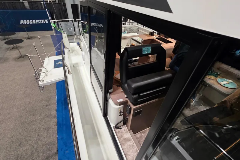 Slide: The Image of 2026 Jeanneau NC 1295 Coupe interior view with seating and modern design. - 90