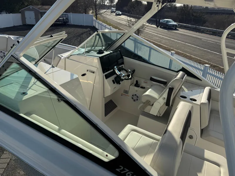 Slide: The Image of 2024 Sailfish 276 DC boat interior with modern helm and seating. - 1