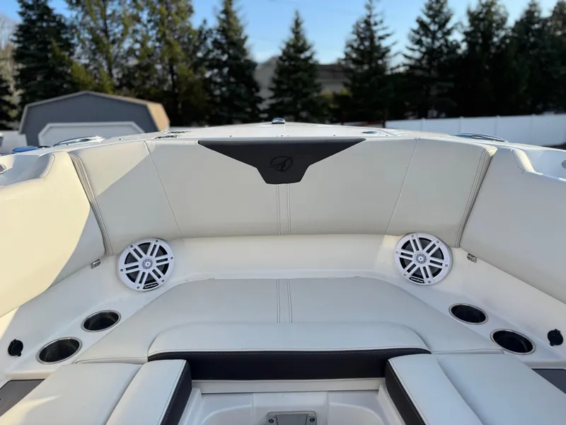 Slide: The Image of 2024 Sailfish 276 DC boat interior with white seating and cup holders. - 7