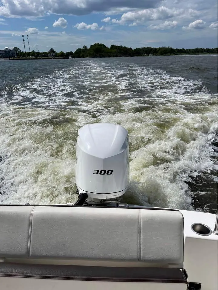 Slide: The Image of 2017 Cutwater C-242 Sport Coupe boat with 300 HP engine cruising on a lake. - 3