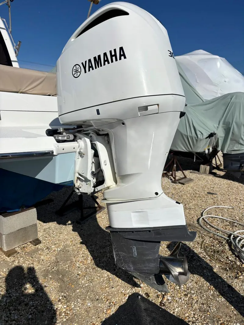 Slide: The Image of 2017 Cutwater C-242 Sport Coupe with Yamaha outboard motor on gravel surface. - 8