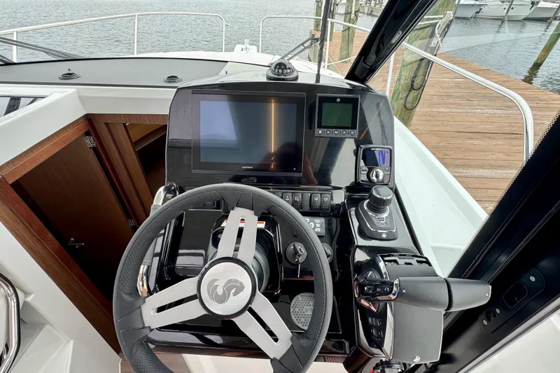 Slide: The Image of 2026 Beneteau Antares 9 helm with modern navigation and control systems. - 17