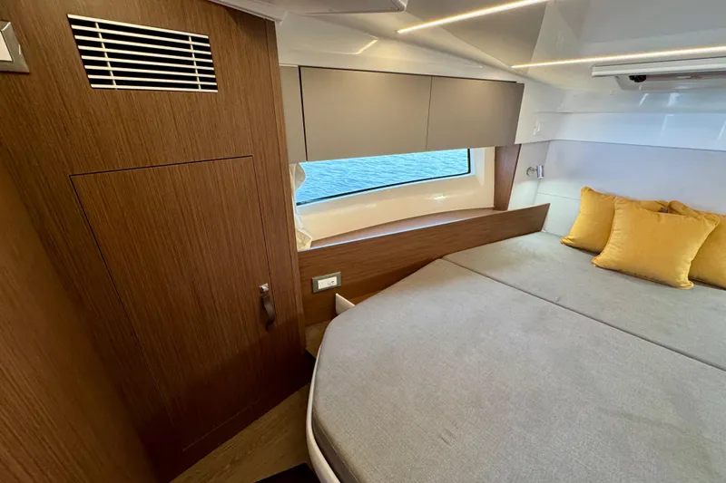 Slide: The Image of Luxurious cabin interior of 2026 Beneteau Antares 9 with modern design and cozy bedding. - 21