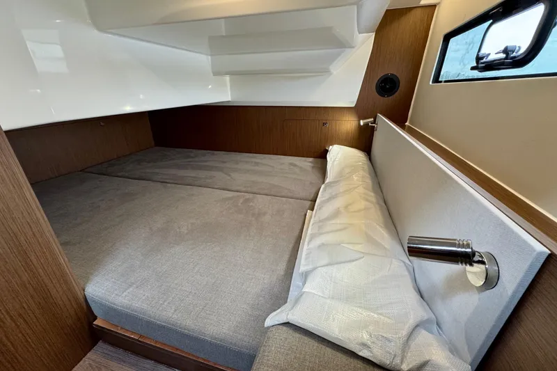 Slide: The Image of 2026 Beneteau Antares 9 cabin interior with modern design and comfortable bedding. - 24