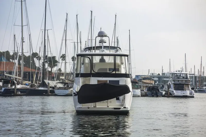 Slide: The Image of 2005 Meridian 459 Motoryacht docked in a marina with sailboats. - 10