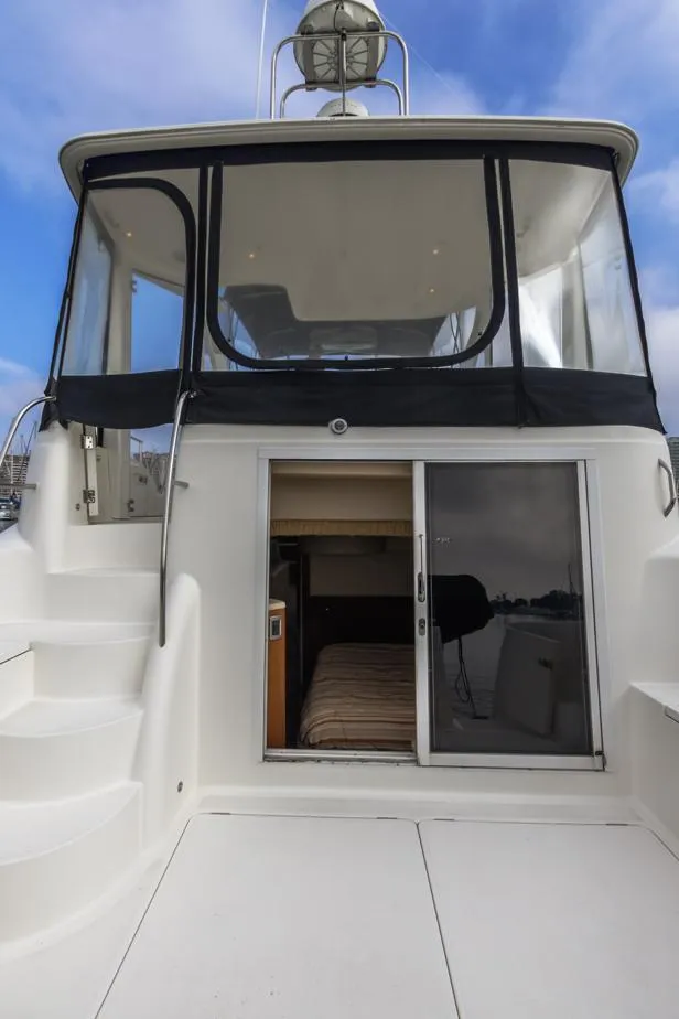 Slide: The Image of 2005 Meridian 459 Motoryacht with open cabin entrance and exterior stairs. - 15