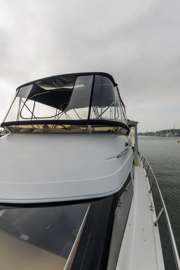 Slide: The Image of 2005 Meridian 459 Motoryacht on calm water under cloudy skies. - 20