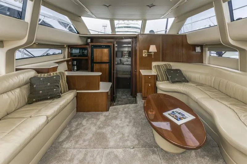 Slide: The Image of Luxurious interior of 2005 Meridian 459 Motoryacht with plush seating and elegant wood finishes. - 34