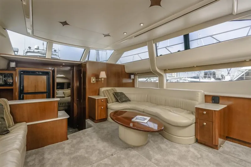 Slide: The Image of Luxurious interior of 2005 Meridian 459 Motoryacht with plush seating and elegant wood finishes. - 35