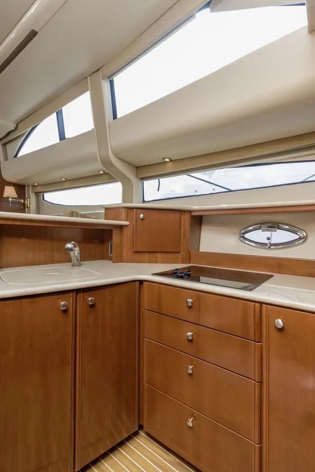 Slide: The Image of 2005 Meridian 459 Motoryacht kitchen with wood cabinetry and modern appliances. - 38