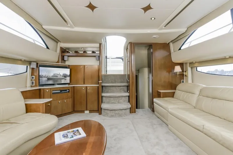 Slide: The Image of Luxurious interior of 2005 Meridian 459 Motoryacht with beige leather seating and wooden cabinetry. - 42