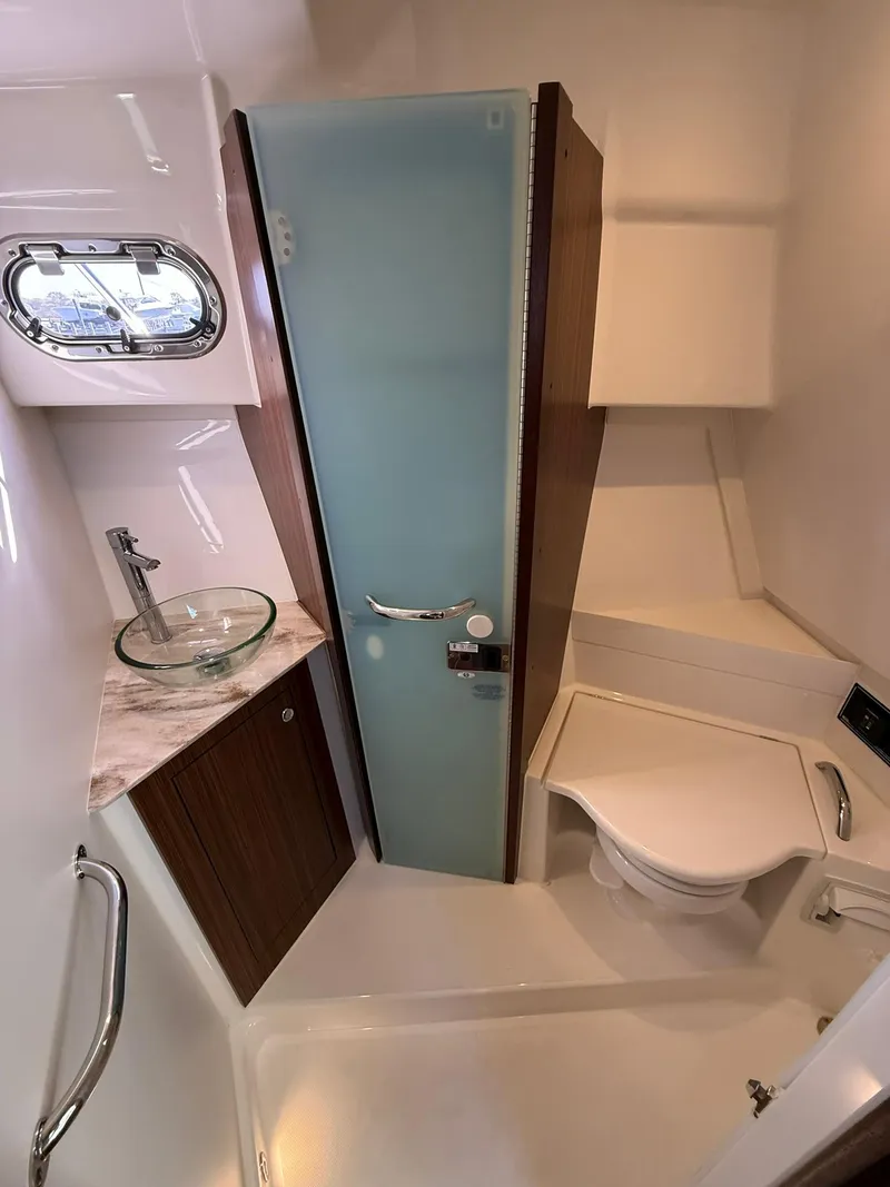 Slide: The Image of 2020 Boston Whaler 325 Conquest bathroom with modern fixtures and compact design. - 46