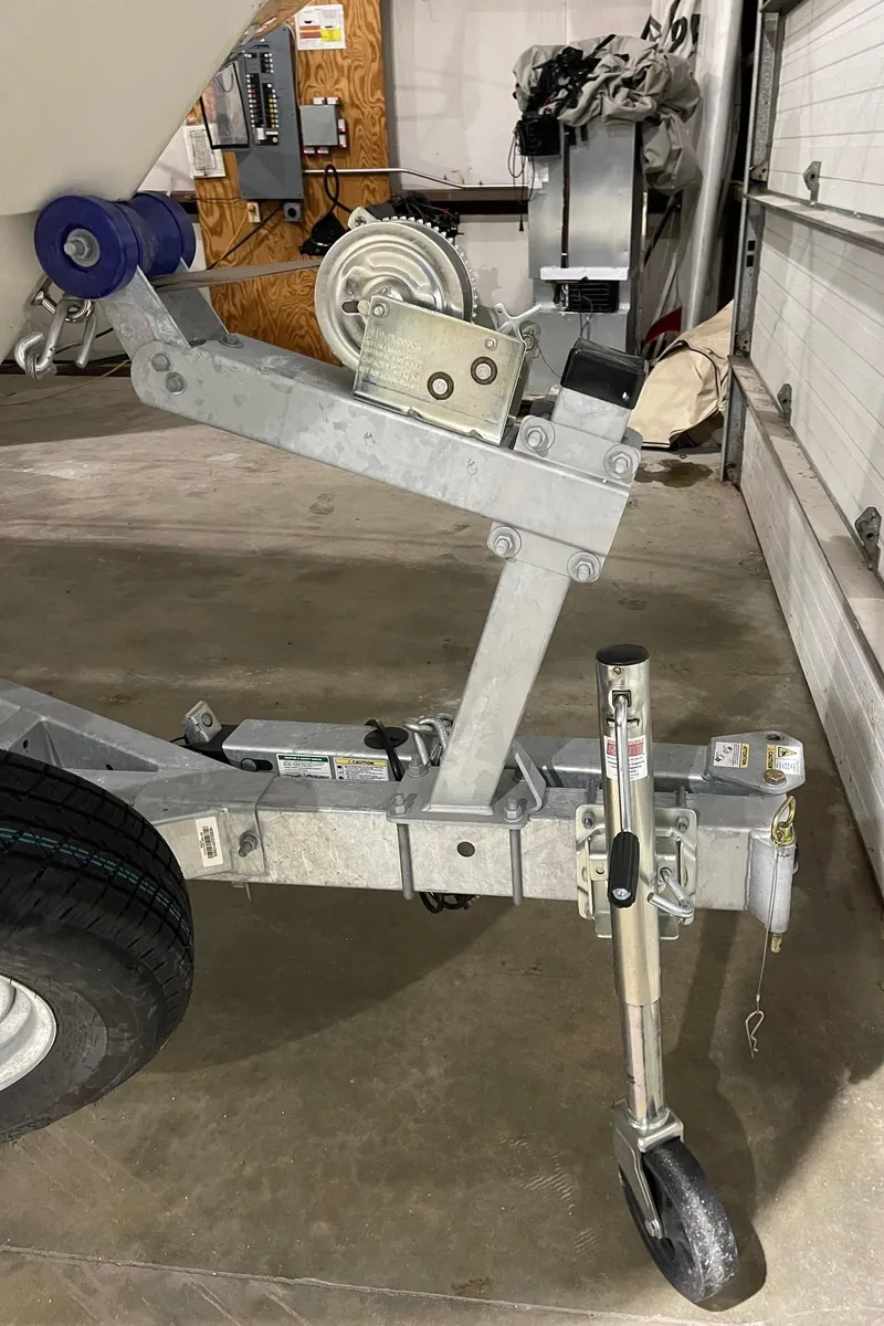 Slide: The Image of Trailer hitch of 2024 Boston Whaler 190 Montauk in a garage setting. - 25