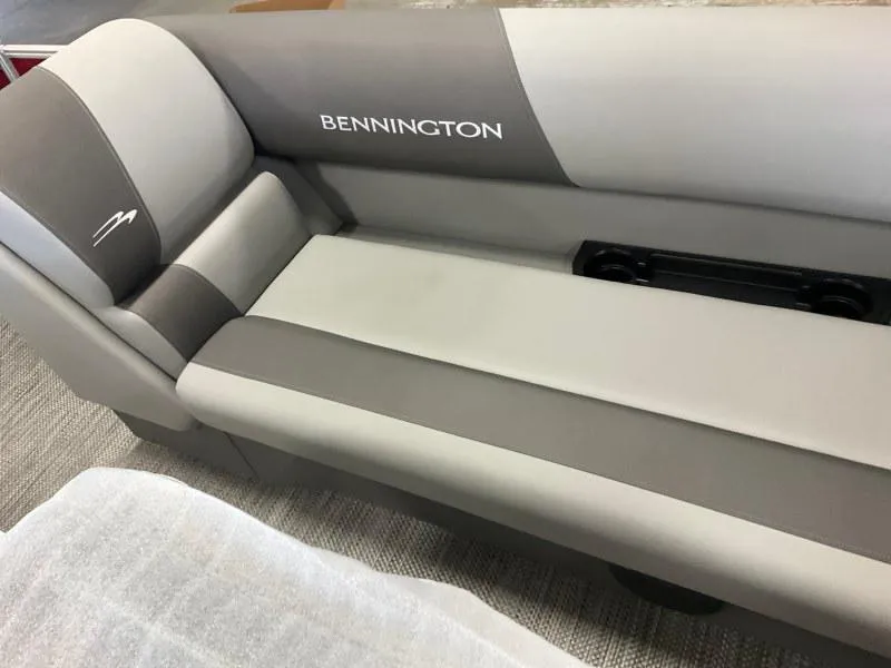 Slide: The Image of 2024 Bennington 20 SVSR SPS boat seat, gray upholstery with logo, cup holders visible. - 10