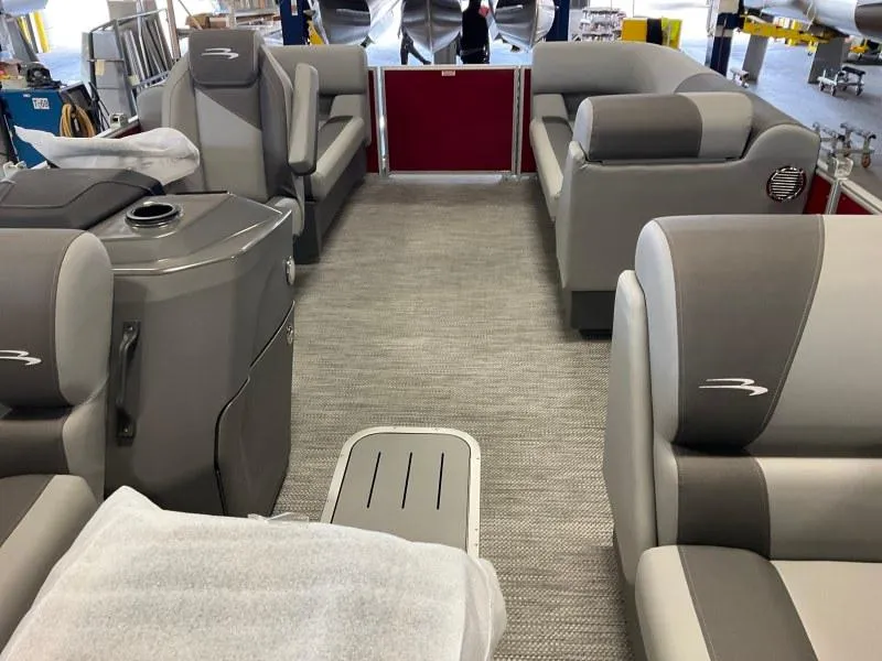 Slide: The Image of 2024 Bennington 20 SVSR SPS pontoon boat interior with gray seating and modern design. - 12