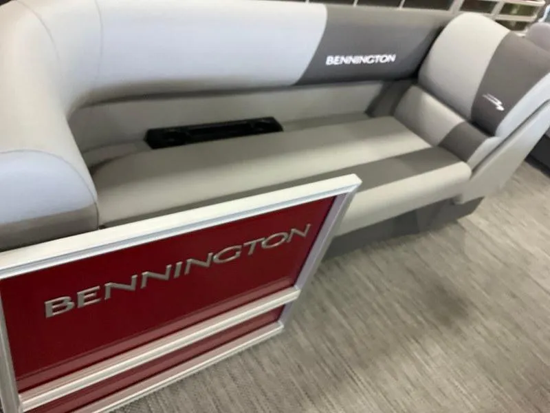 Slide: The Image of 2024 Bennington 20 SVSR SPS boat interior with gray seating and red panel. - 4