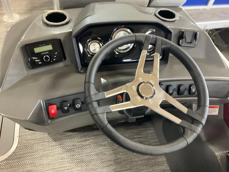 Slide: The Image of 2024 Bennington 20 SVSR SPS dashboard with steering wheel and control panel. - 7
