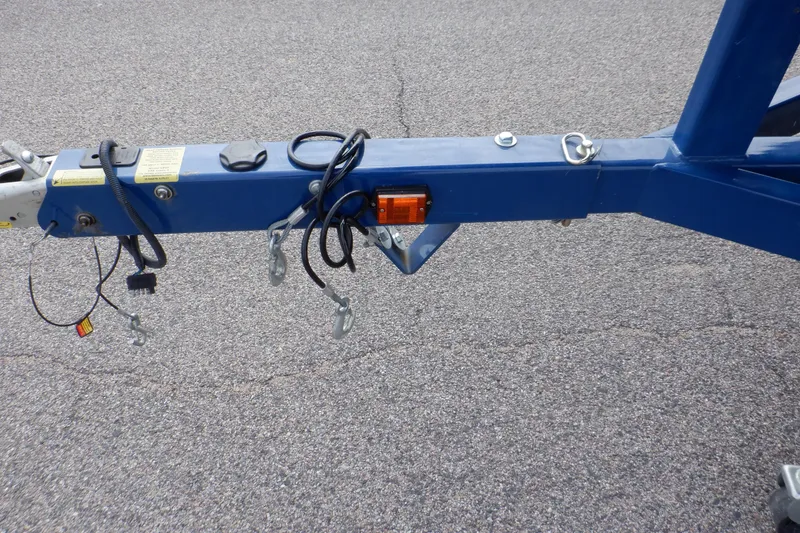 Slide: The Image of Trailer hitch of a 2018 Four Winns HD200 boat on asphalt surface. - 16
