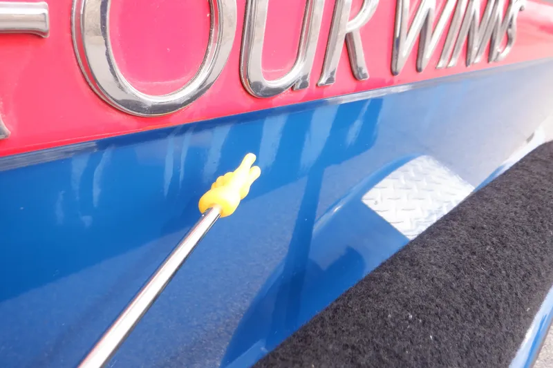 Slide: The Image of 2018 Four Winns HD200 boat with red and blue detailing. - 26