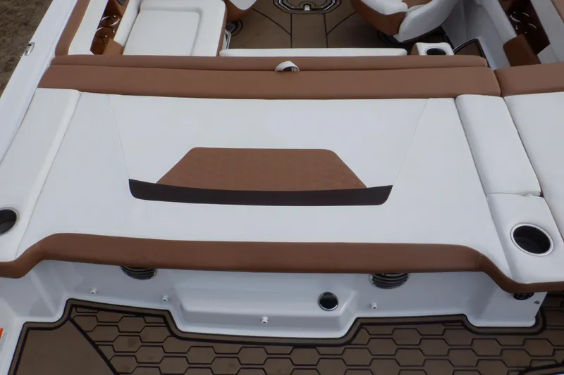 Slide: The Image of 2018 Four Winns HD200 boat interior with brown and white seating. - 33