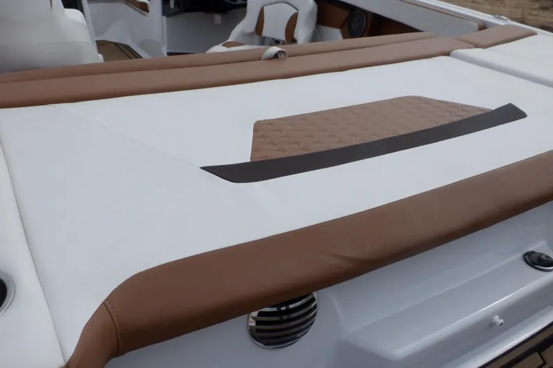 Slide: The Image of 2018 Four Winns HD200 boat interior with brown and white seating. - 34